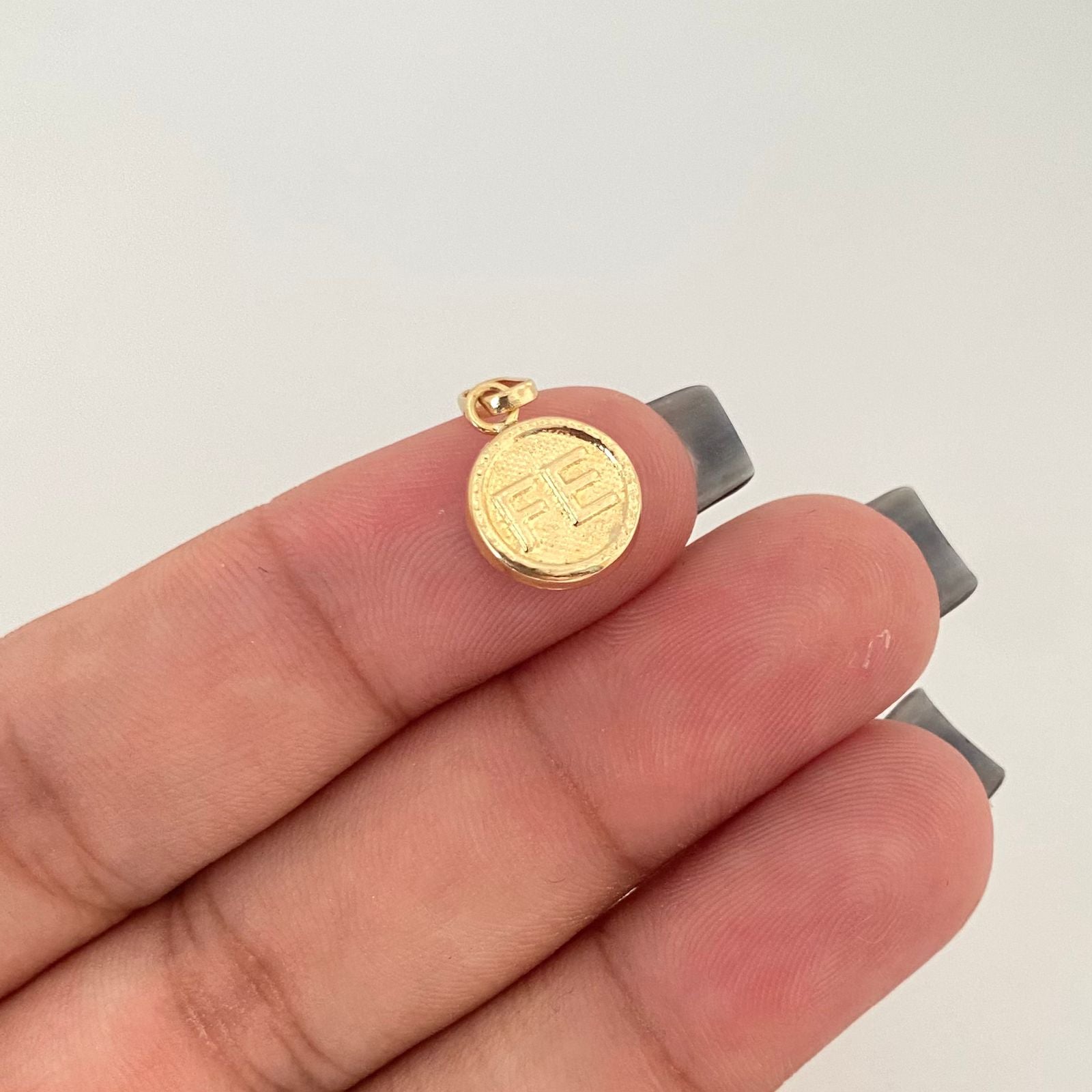 Dije fe troquelado Oro amarillo 18k 0,85 Gr / 2,0 Cm