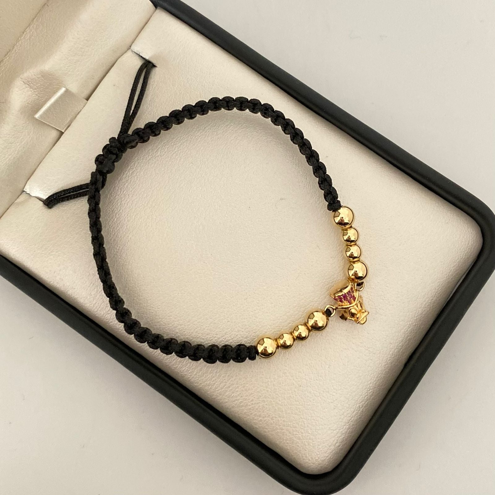 Pulsera tejida con herraje tio rico con circones rosados y bolas lisas 5mm y 4mm  Oro amarillo 18k 2 Gr