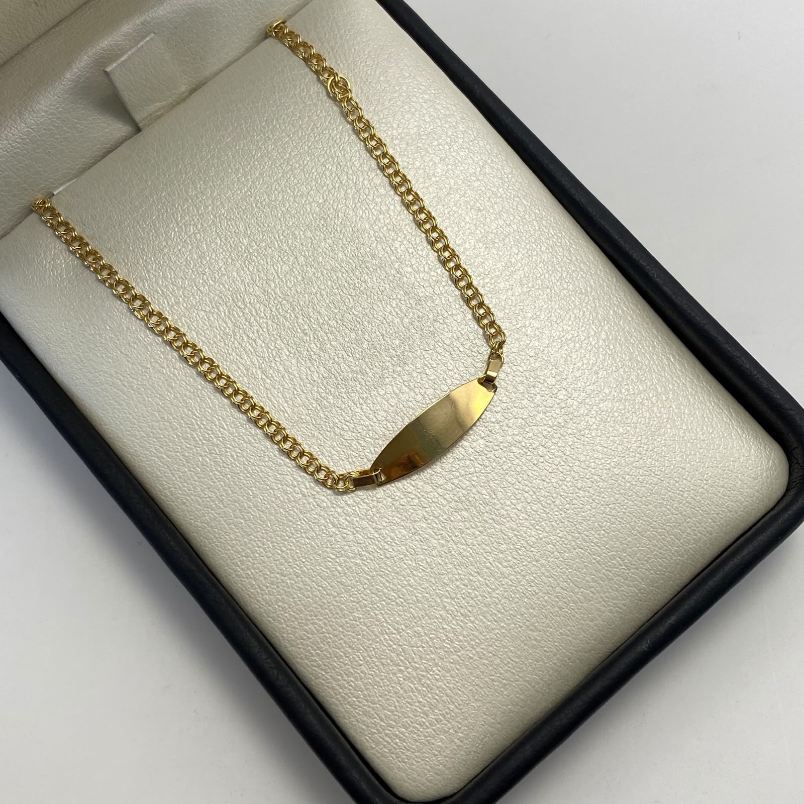 Pulso bebé aro seguidos placa ovalo  Oro amarillo 1,35 Gr / 1,5 mm / 15 Cm Broche 0,20