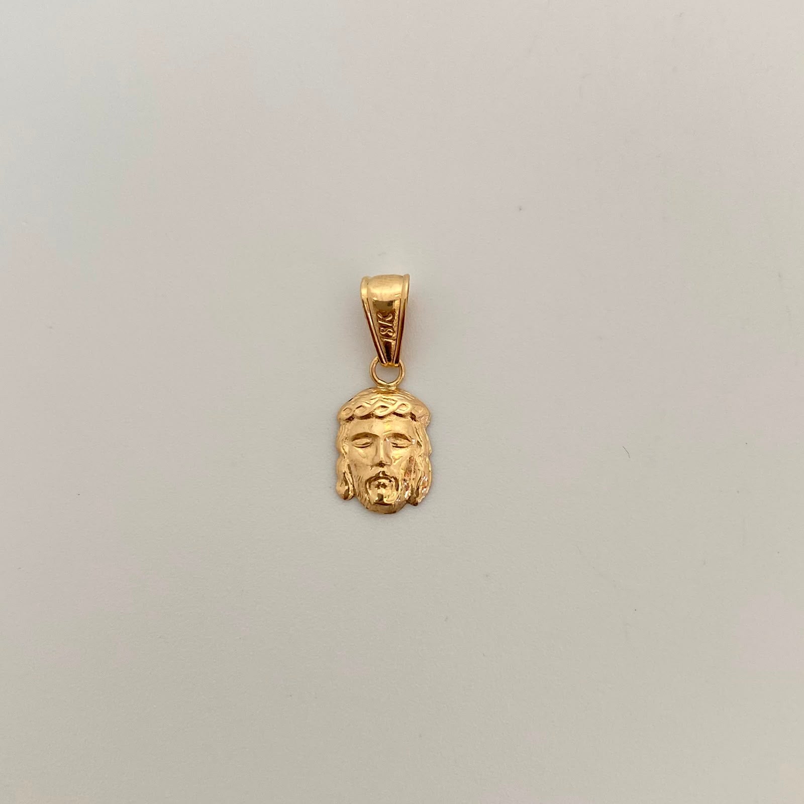 Dije Rostro Oro amarillo 18k 0,55 Gr / 8,2 mm / 2 Cm