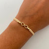 Pulsera tejida Infinito bolas lisas 4mm beige Oro amarillo 18k 0,6 Gr