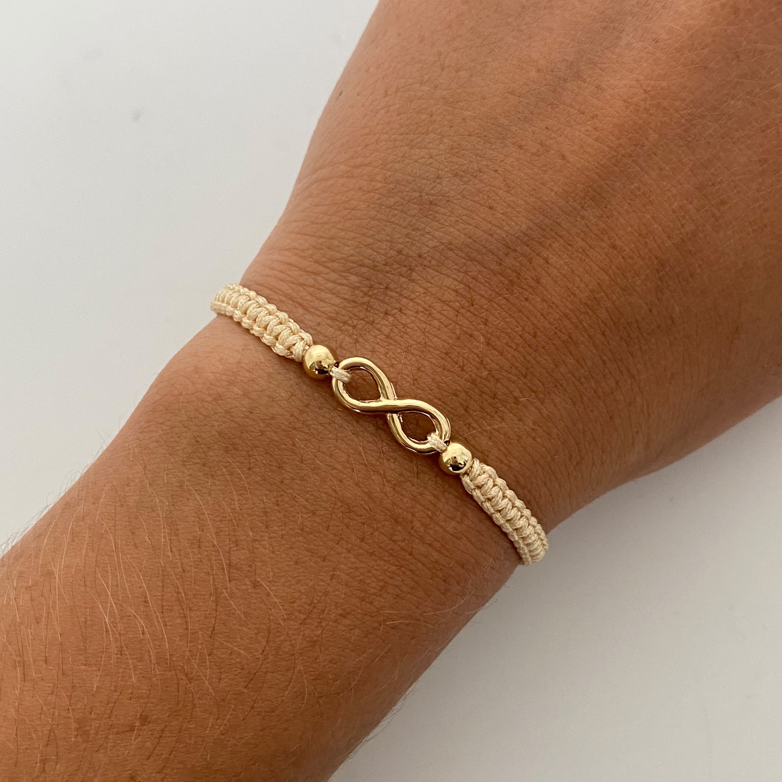 Pulsera tejida Infinito bolas lisas 4mm beige Oro amarillo 18k 0,6 Gr
