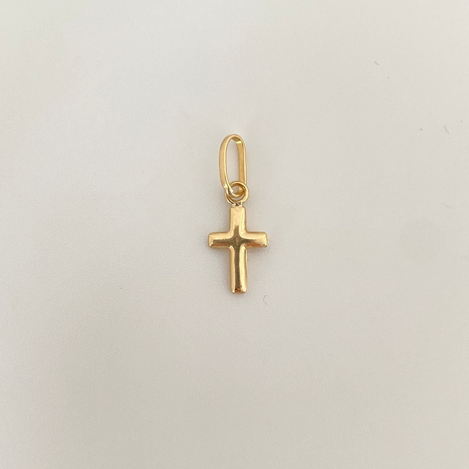 Dije mini cruz lisa Oro amarillo 18k 0,55 Gr / 2,0 Cm