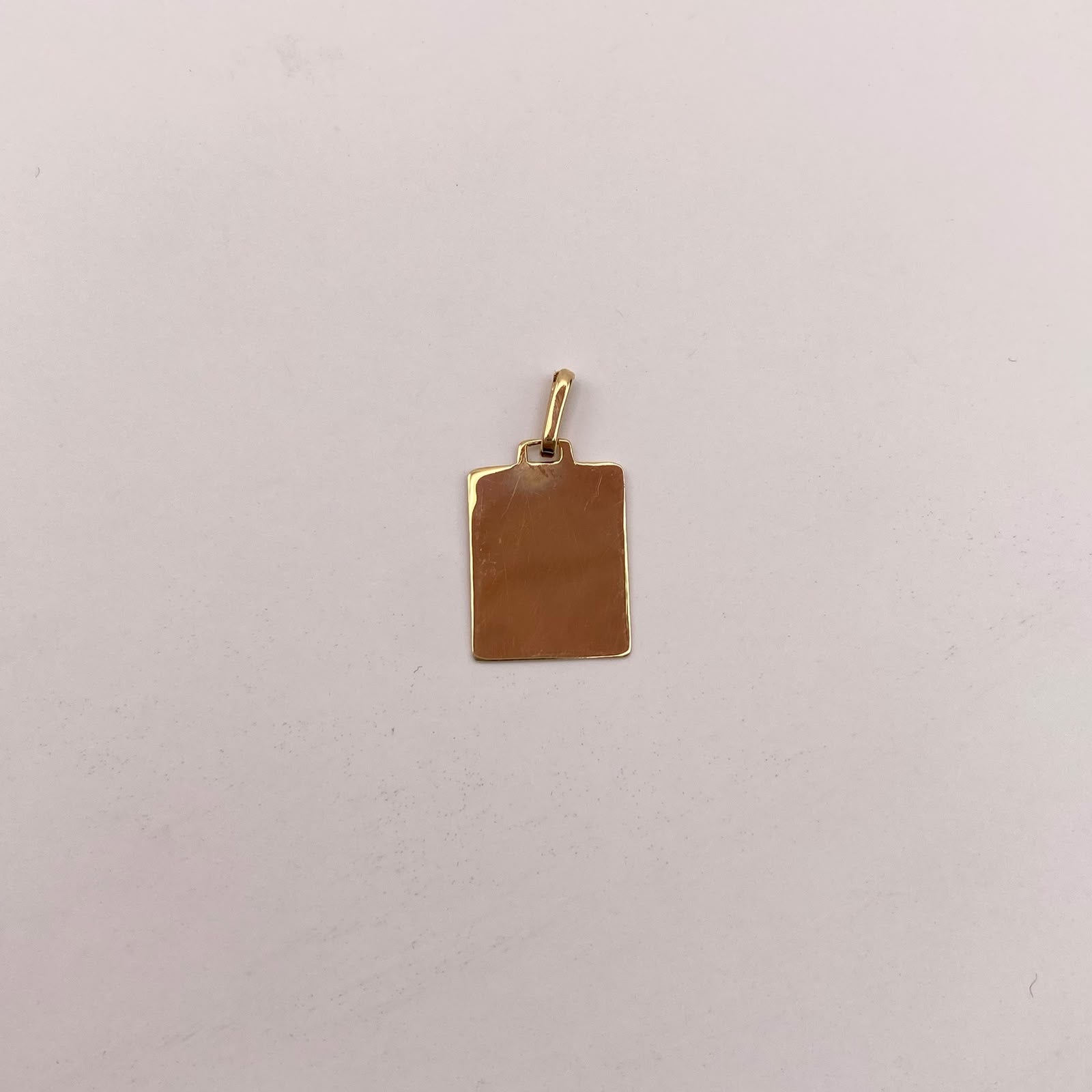 Dije placa lisa Oro amarillo 18k 0,95 Gr / 11,9 mm / 2,5 Cm