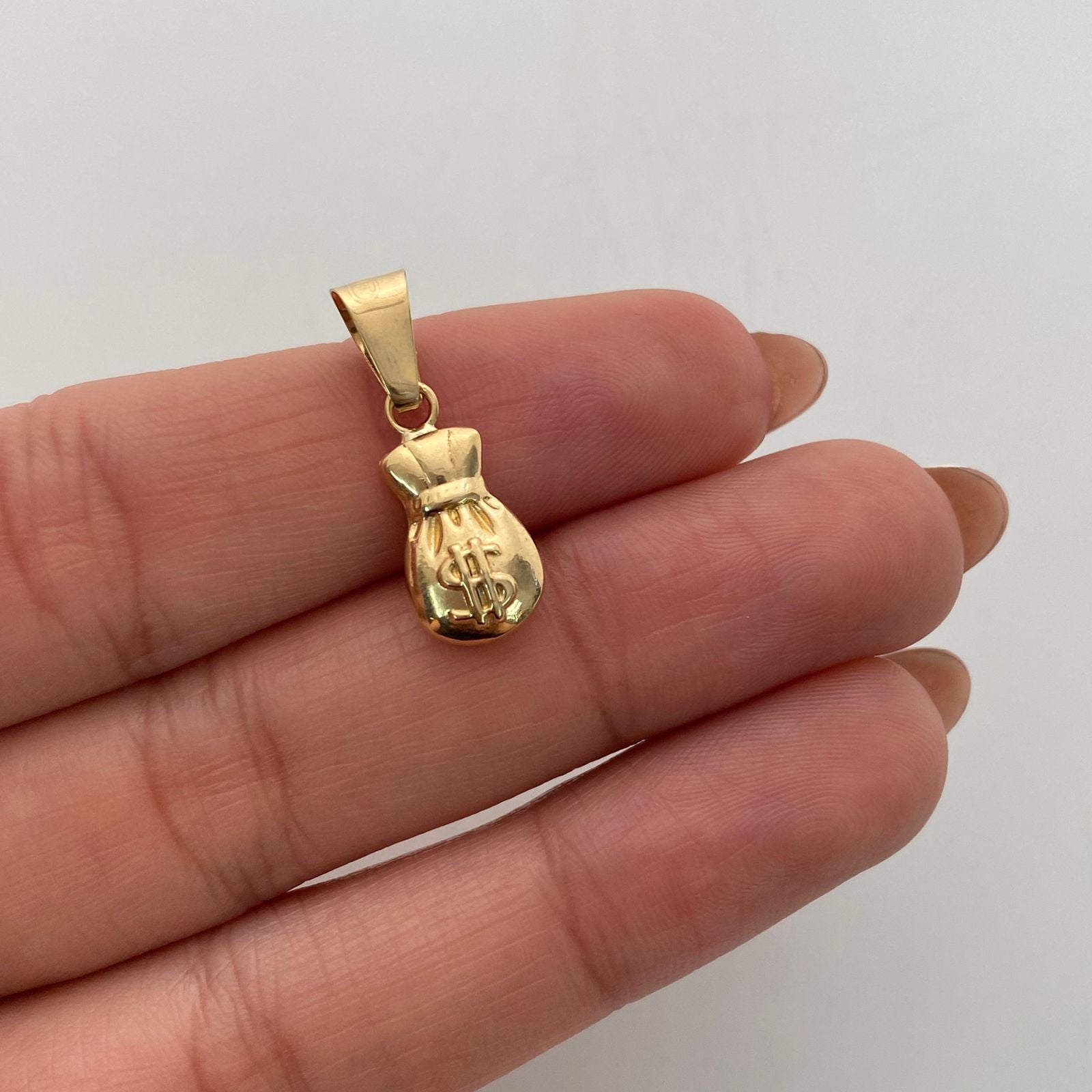 Dije Bolsa de Valores Oro amarillo 18k 0,95 Gr / 8,2 mm / 2,4 Cm
