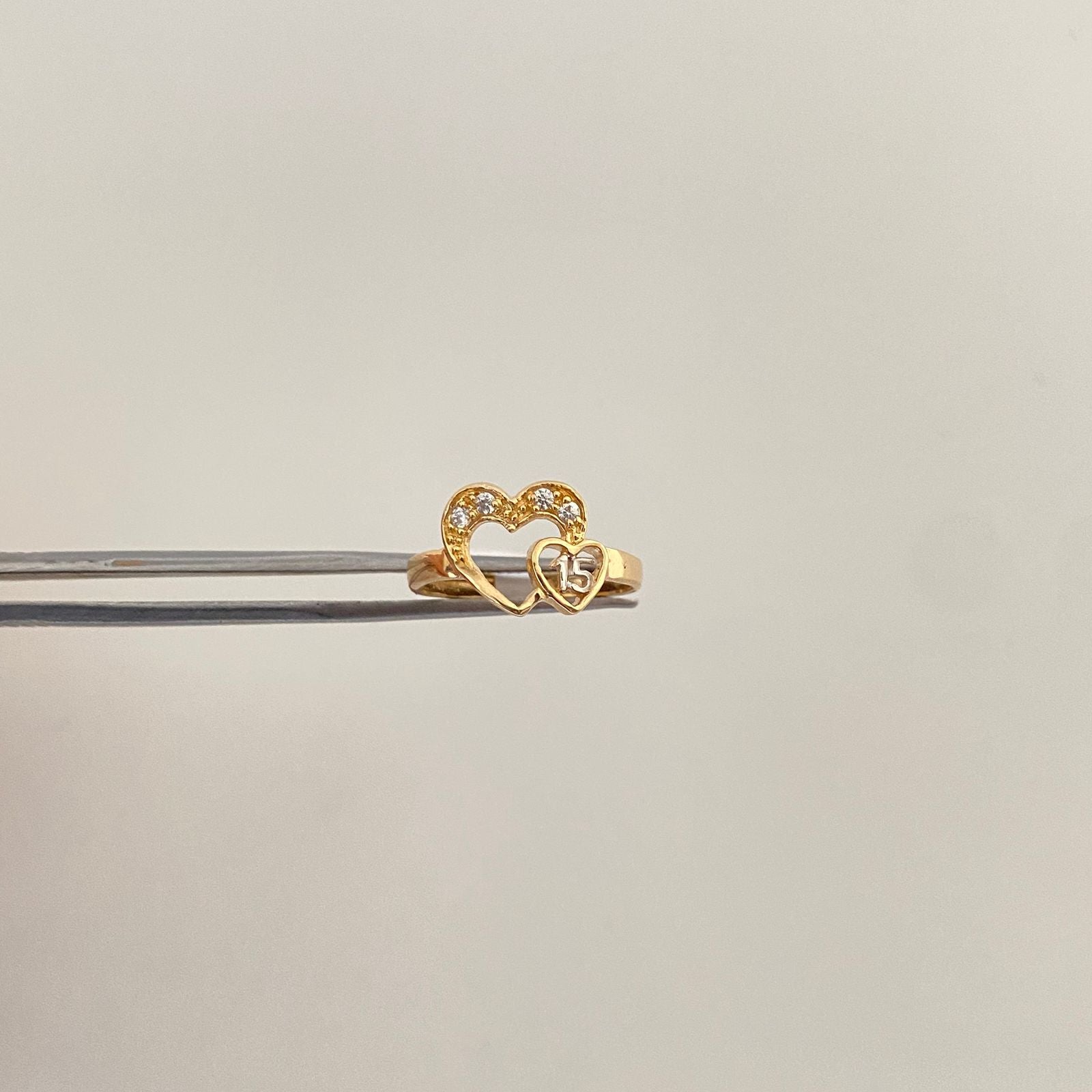 Anillo corazon 15´s casting Oro amarillo y Oro blanco 18k / Talla 5 / 1,65 Gr