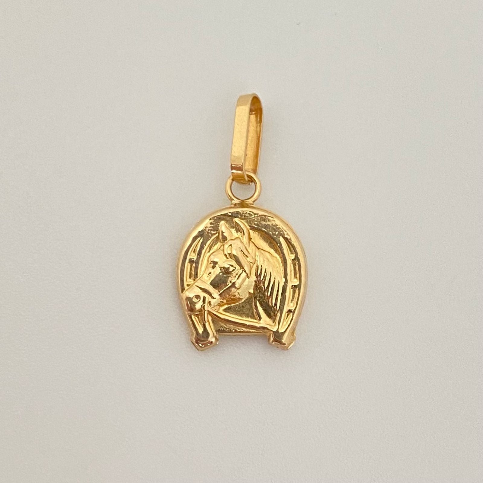 Dije herradura caballo Oro amarillo 18k 0,80 Gr / 2,0 Cm
