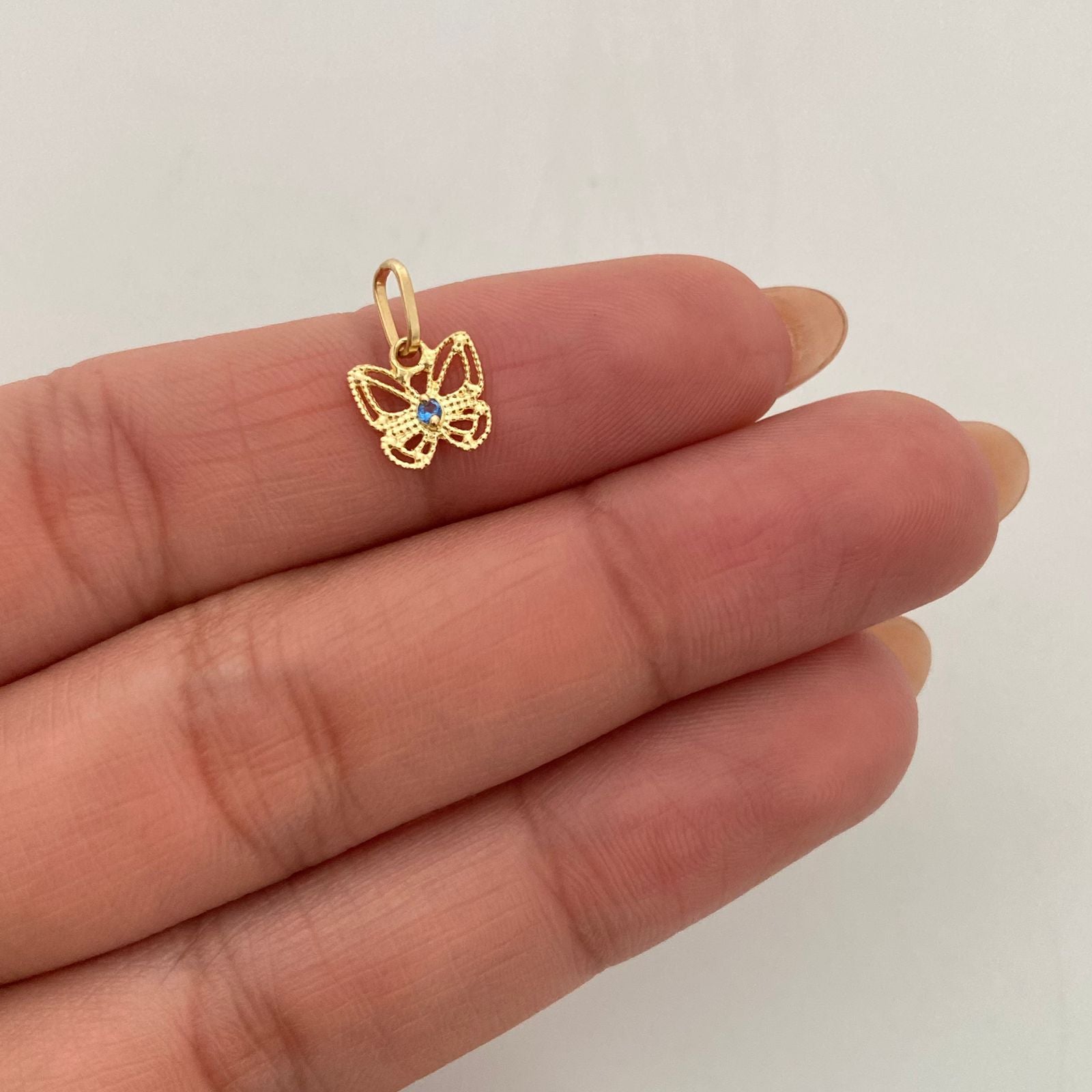 Dije Mariposa circon azul Oro amarillo 18k 0,5 Gr / 8,0 mm / 1,3 Cm