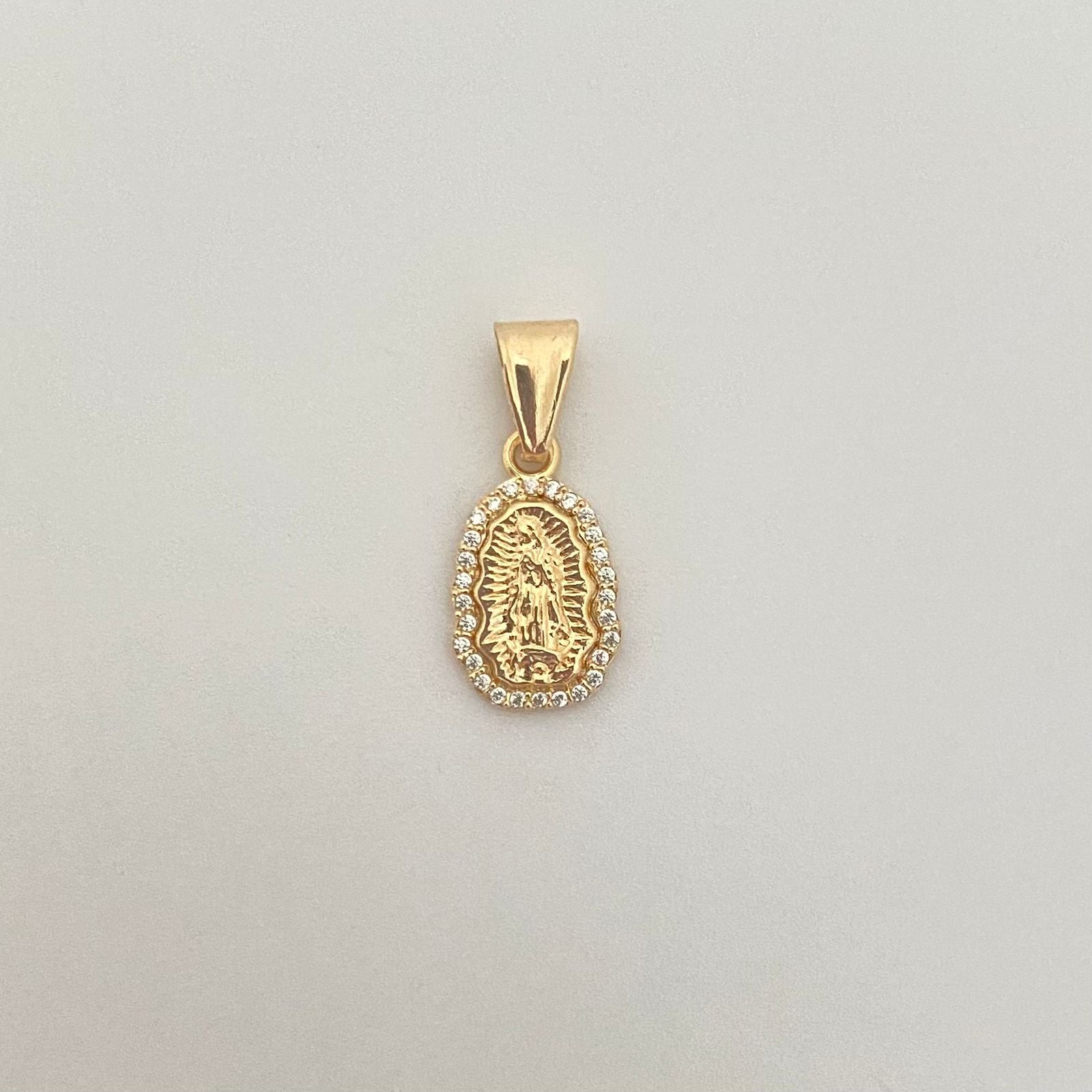 Dije silueta virgen guadalupe borde casting Oro amarillo 18k 0,65 Gr / 2,0 Cm