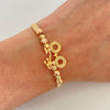 Pulsera tejida con herraje de bicileta y balines diamantados #3 y #4  Oro amarillo y Oro blanco 18k 2,75 Gr