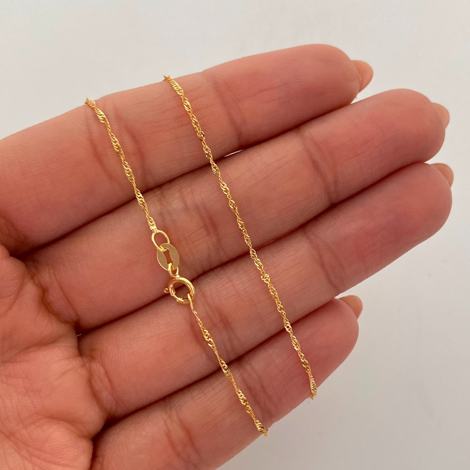 Cadena It Mini Singapur Oro amarillo 18k +1 / 1,3 Gr / 1,2 mm / 50 Cm