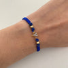 Pulsera tejida con herraje de niño con circones blanco y balines diamantados 4mm  Oro amarillo 18k 0,75 Gr