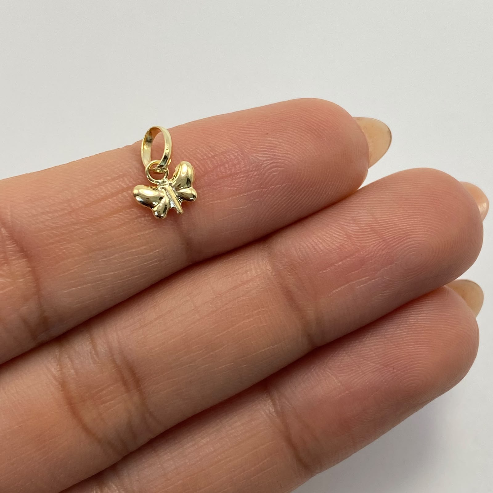 Dije Mariposita Oro amarillo 18k 0,25 Gr / 7,2 mm / 1 Cm