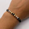 Pulsera tejida Bolas diamantadas 8mm y neoro una raya 8mm Tres oros 18k 1,30 Gr