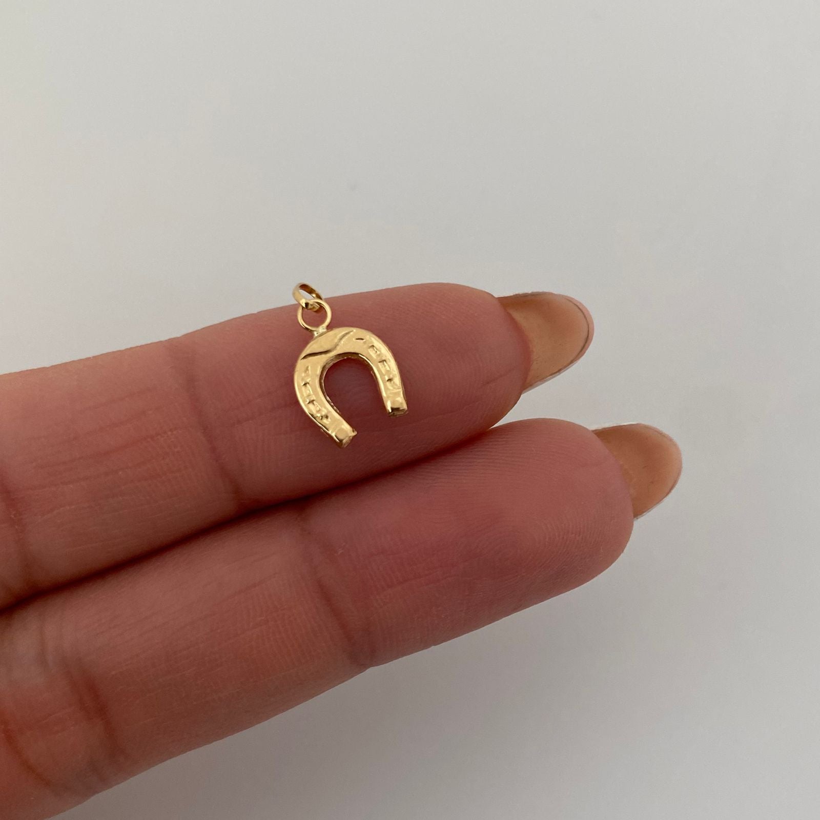 Dije herradura  Oro amarillo 18k 0,3 Gr / 1,5 Cm