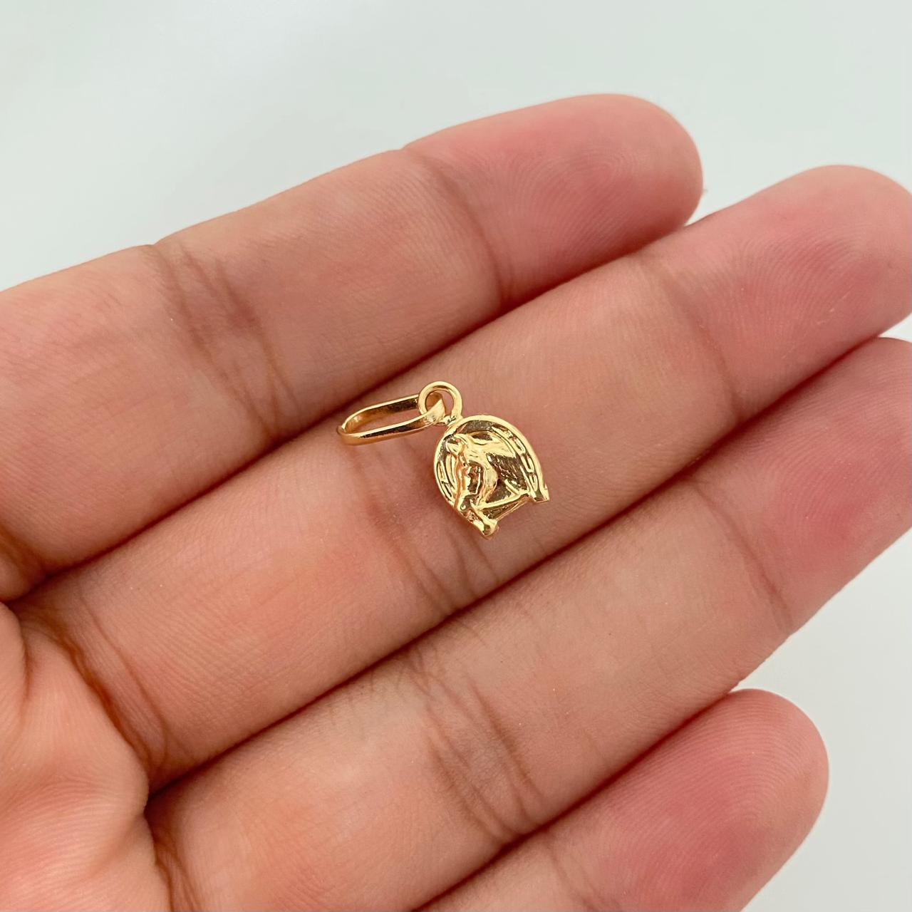 Dije mini herradura de caballo Oro amarillo 18k 0,55 Gr / 1,8 Cm