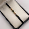 Pulsera tejida Bolas diamantadas 8mm y neoro una raya 8mm Tres oros 18k 1,30 Gr