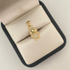 Dije caricatura LB casting blanco Oro amarillo 18k 1,20 Gr / 2,1 Cm