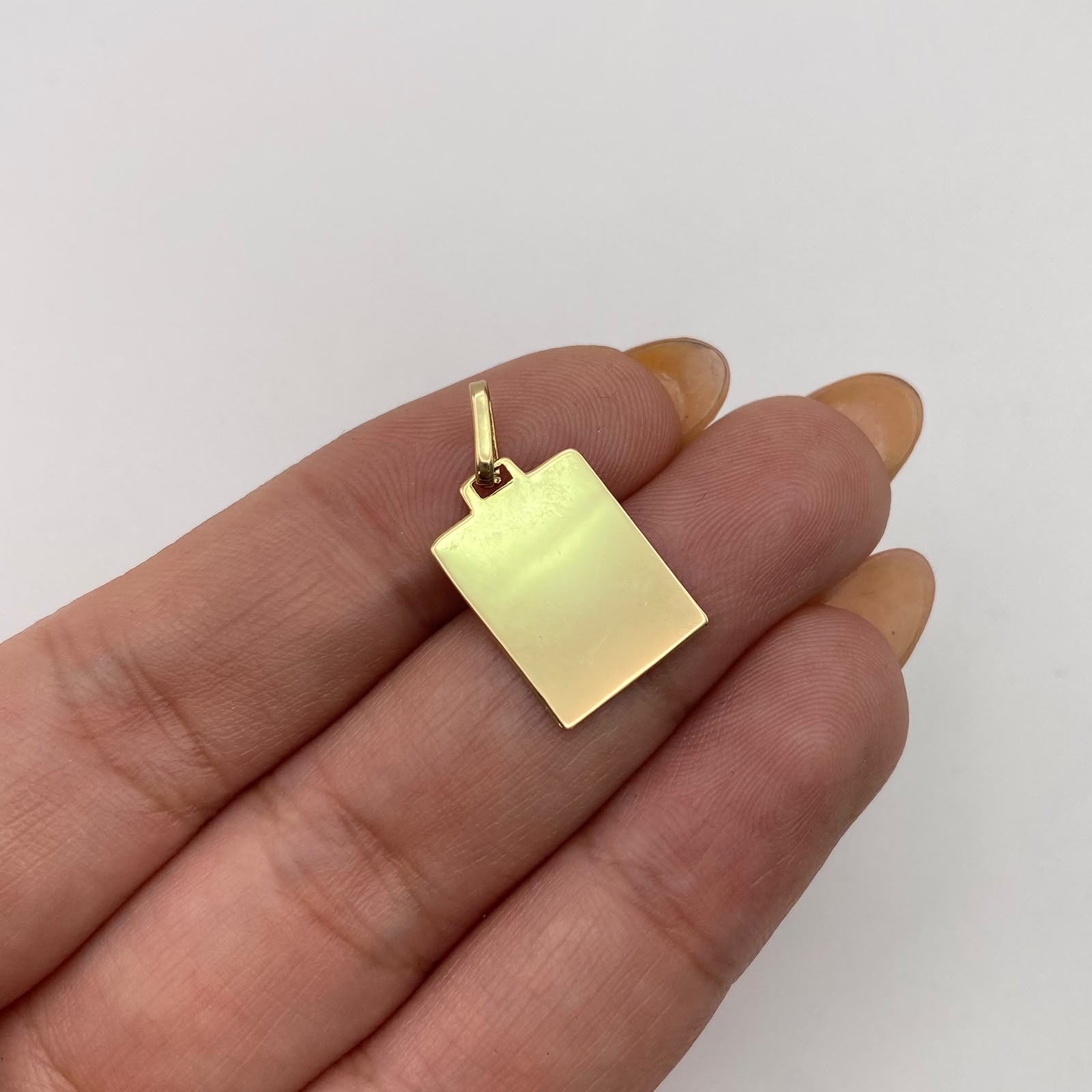 Dije placa lisa Oro amarillo 18k 0,95 Gr / 11,9 mm / 2,5 Cm