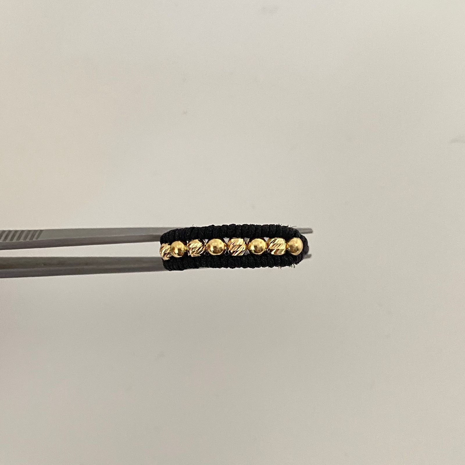 Anillo tejido balines lisos y diamantados #3 Oro amarillo 18k/ 0,4 Gr