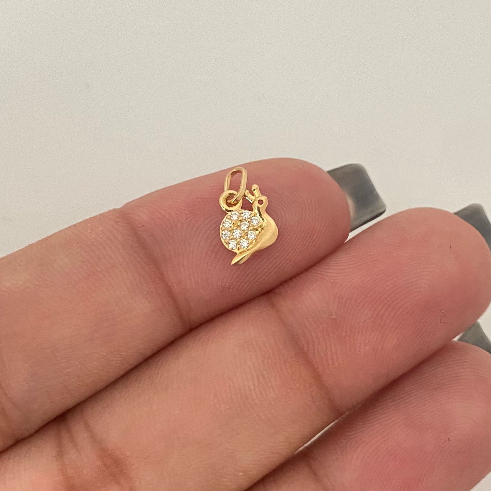 Dije caracol casting Oro amarillo 18k 0,35 Gr / 1,0 Cm