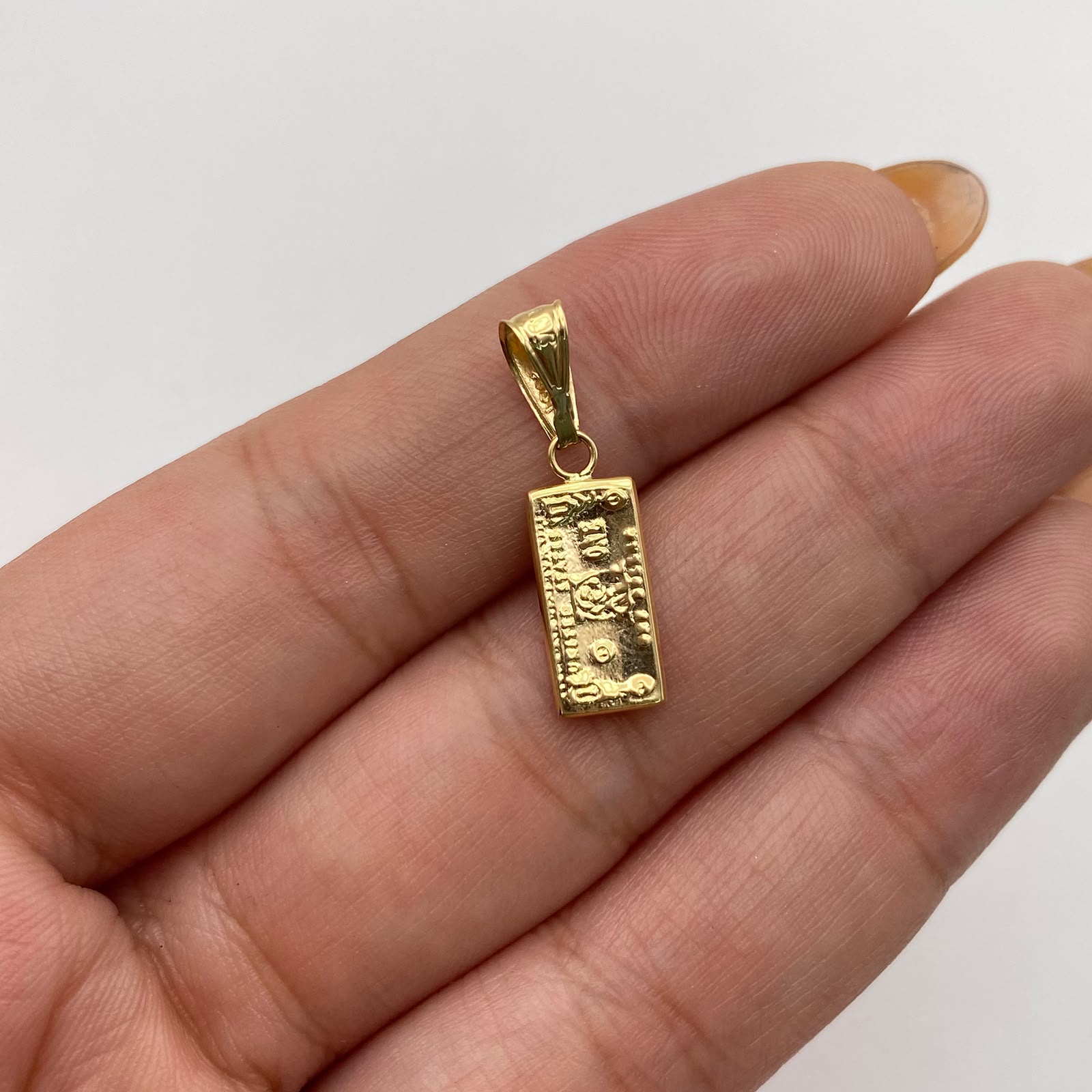 Dije dolar Oro amarillo 18k 0,65 Gr / 6,56 mm / 2,5 Cm
