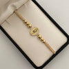 Pulsera tejida herraje virgen de guadalupe casting balines #5 diamantados y lisos beige Oro amarillo 18k 2,9 Gr