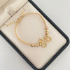 Pulsera tejida con herraje de bicileta y balines diamantados #3 y #4  Oro amarillo y Oro blanco 18k 2,75 Gr