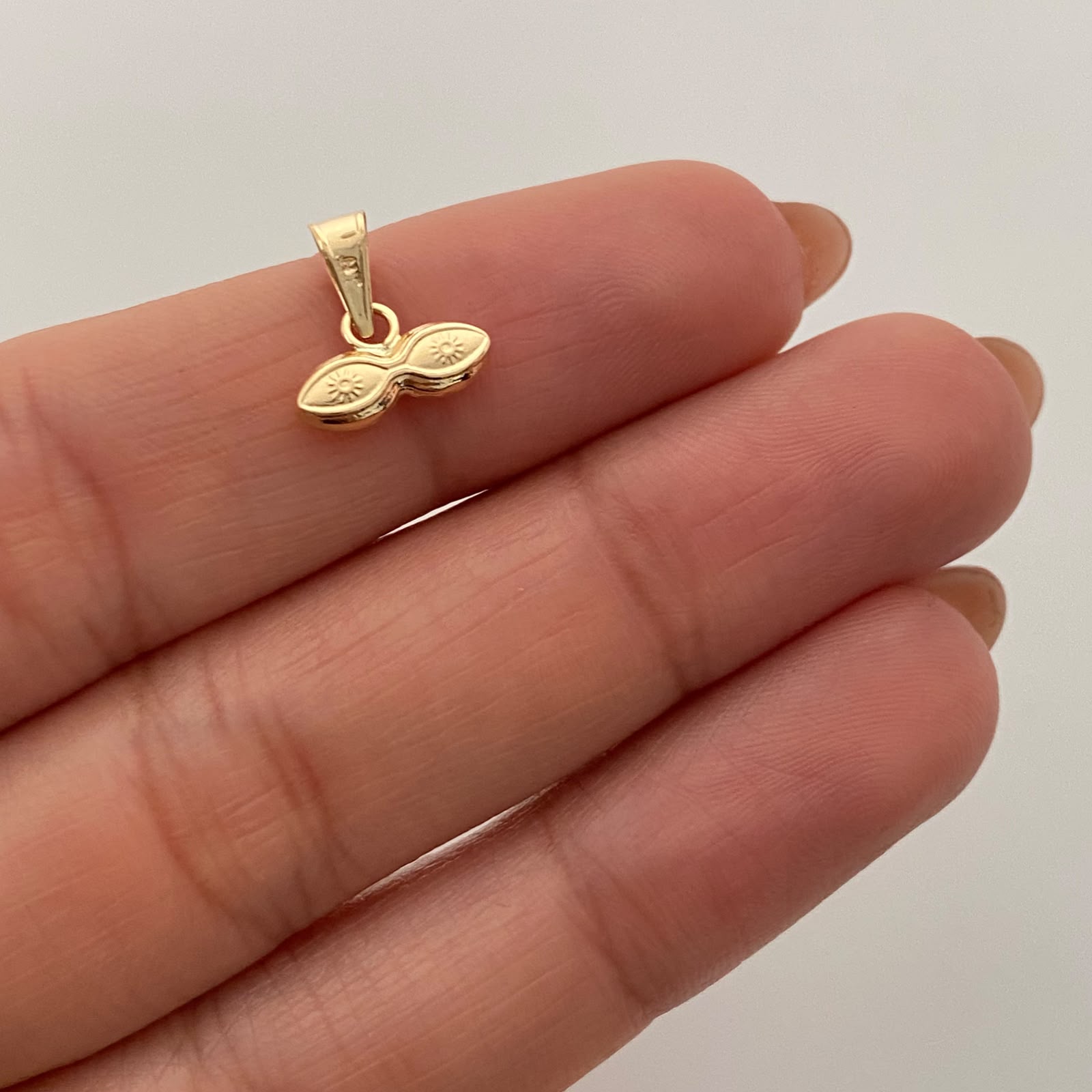 Dije Ojos de Santa Lucía Oro amarillo 18k 0,3 Gr / 10,8 mm / 1 Cm