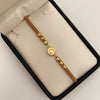 Pulsera tejida con herraje letra c y balines diamantados 4mm Oro amarillo 18k 1,25 Gr
