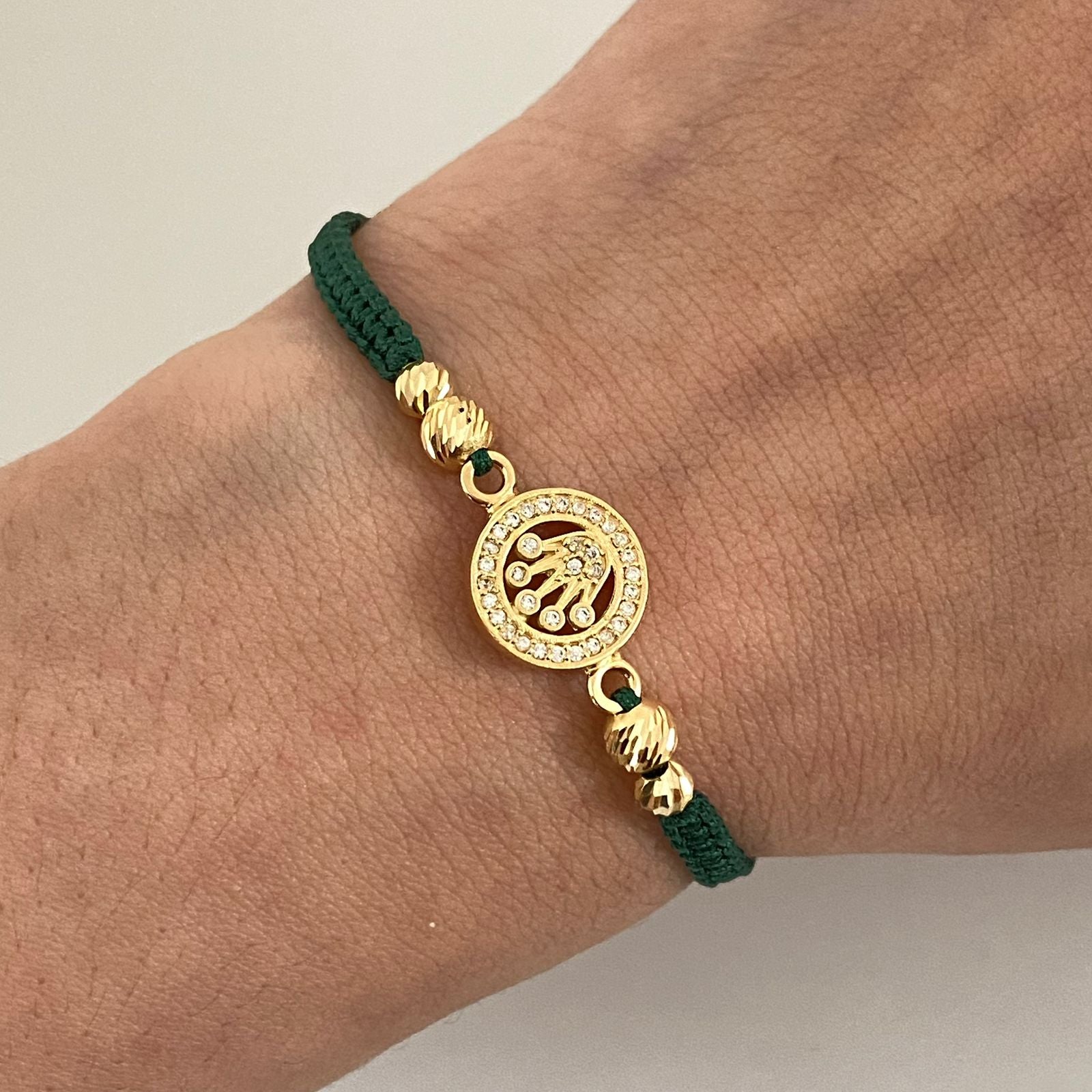 Pulsera tejida con herraje rx y bolas diamantadas 4mm y 3mm Oro amarillo 18k 2,25 Gr