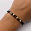 Pulsera tejida Bolas diamantadas 6 y 5mm con neoros 6mm tres rayas y neoro 6mm una raya Oro amarillo 18k 0,4 Gr