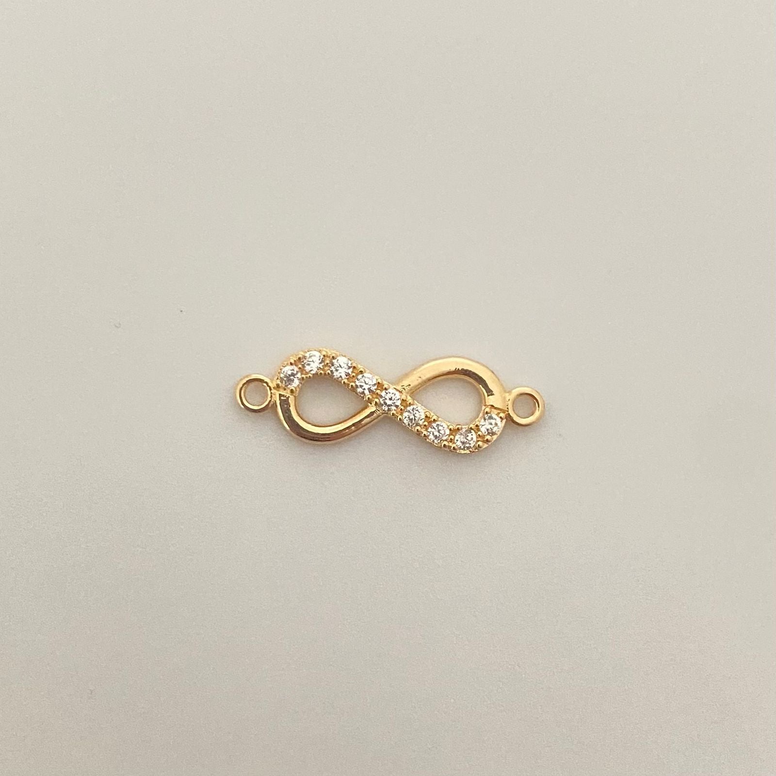 Herraje infinito mitad casting y liso Oro amarillo 18k 0,85 Gr / 2,0 Cm