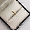 Dije mini cruz ovalada circones blancos Oro amarillo 18k 0,45 Gr / 6,42 mm / 1,2 Cm