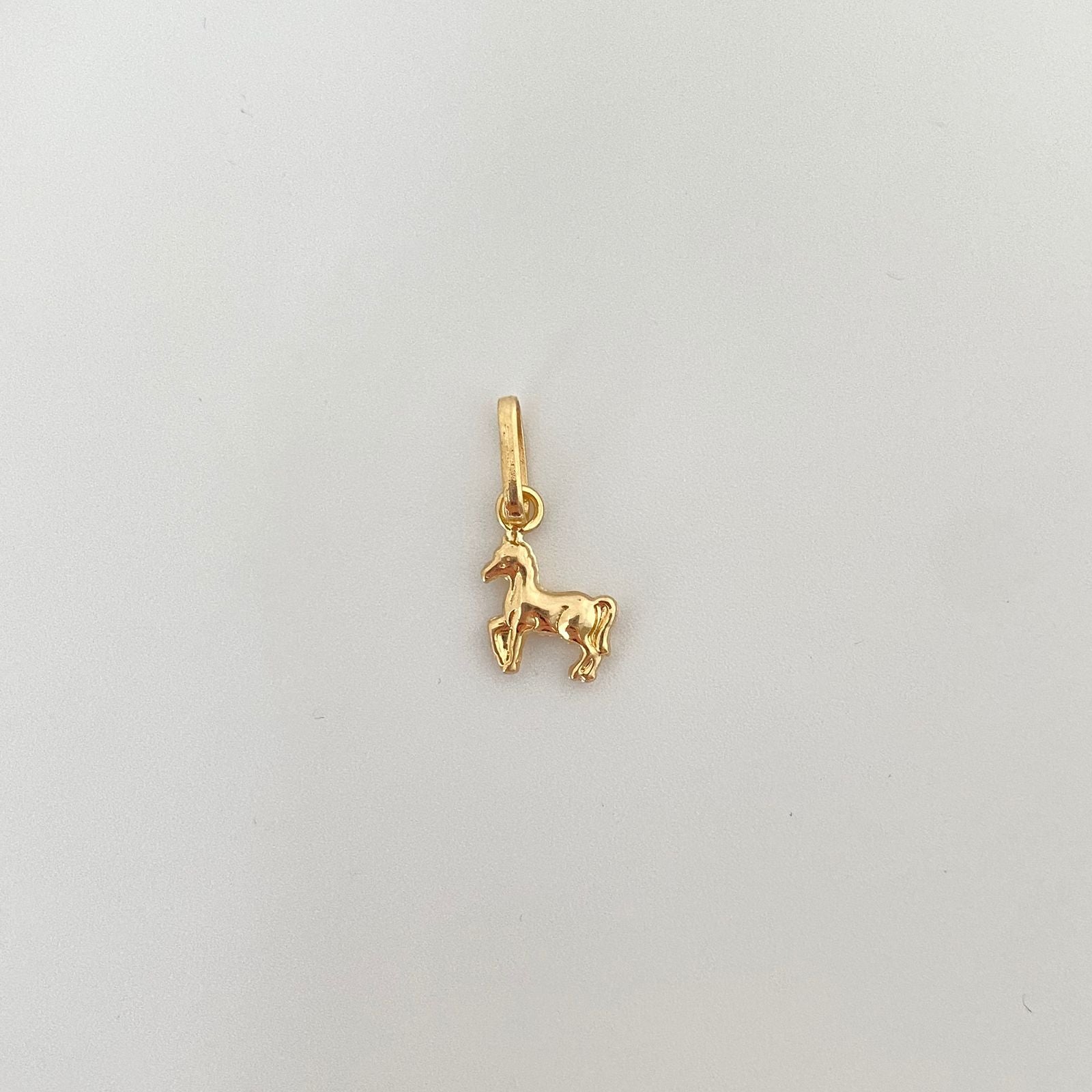 Dije Caballo Oro amarillo 18k 0,55 Gr / 10,7 mm / 1,5 Cm