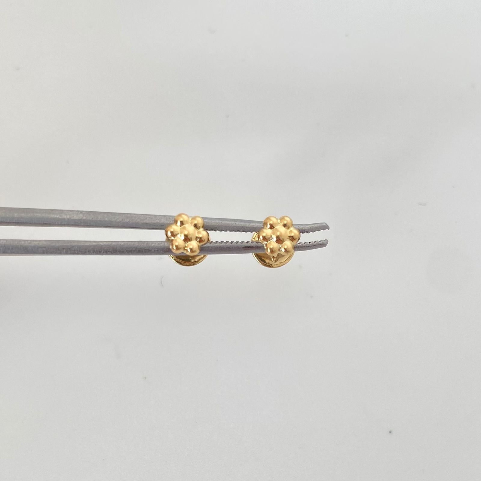 Topos flor Oro amarillo 18k 0,5 Gr / 4,9 mm