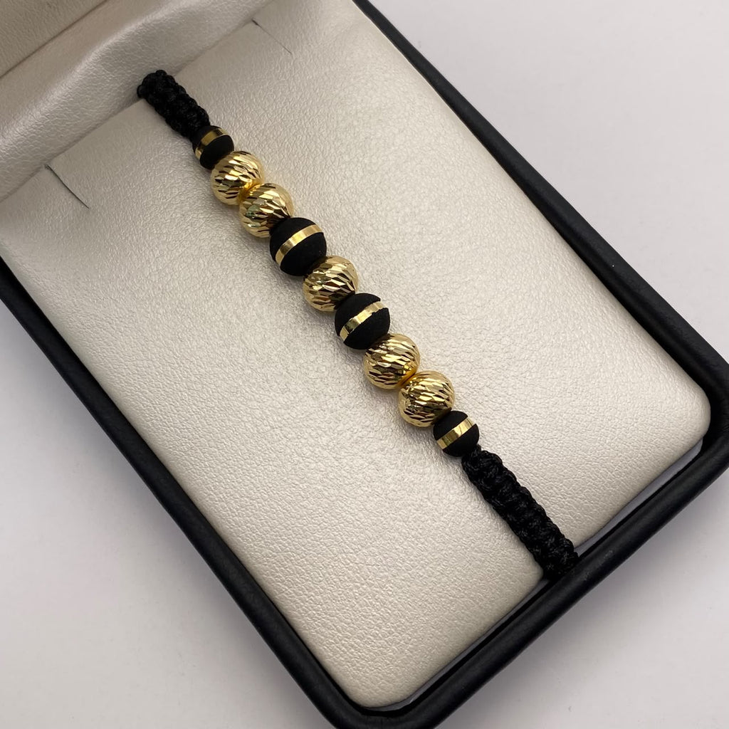 Pulsera tejida Bolas diamantas 8mm con neoro una raya 8mm y 6mm una raya  Oro amarillo 18k 1,15 Gr