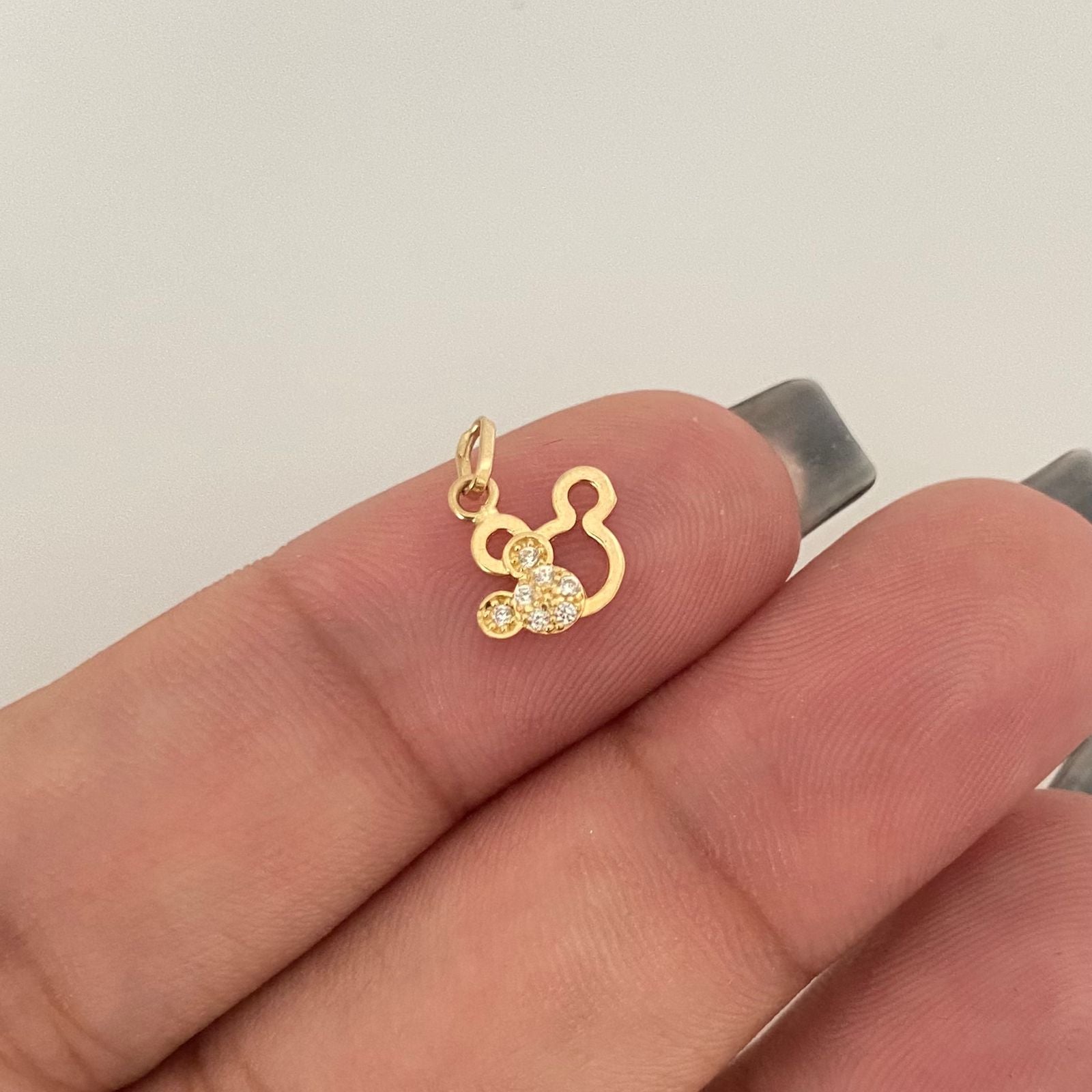 Dije silueta mickey esquina casting Oro amarillo 18k 0,45 Gr / 1,2 Cm