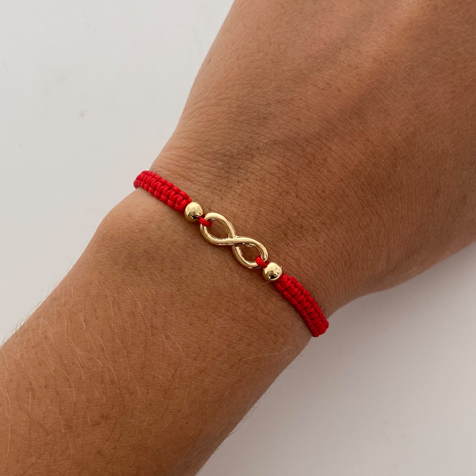 Pulsera tejida Infinito bolas lisas 4mm Roja Oro amarillo 18k 0,6 Gr