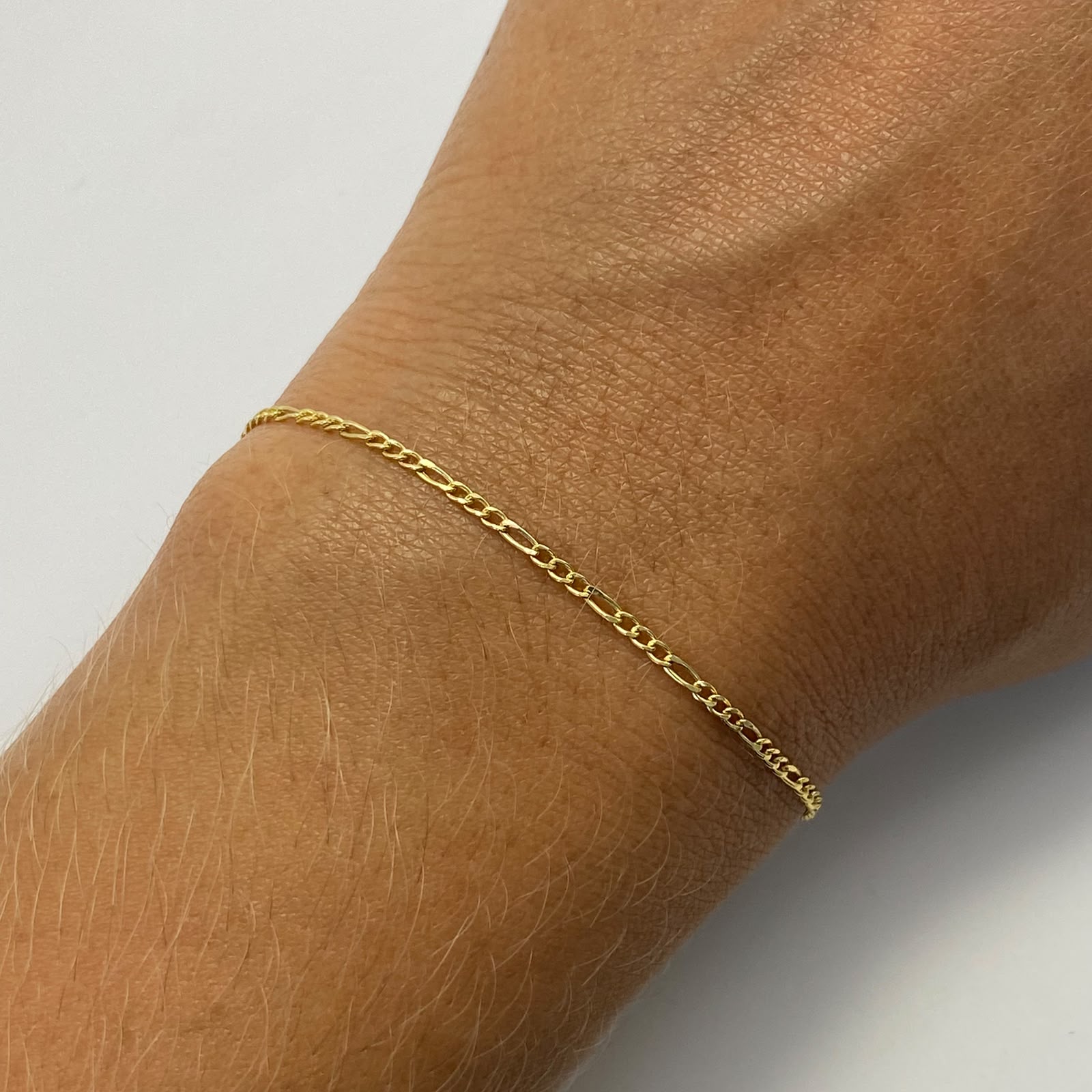 Tobillera It mini 3x1 Oro amarillo 18k +1 / 0,9 Gr / 2 mm / 24,5 Cm