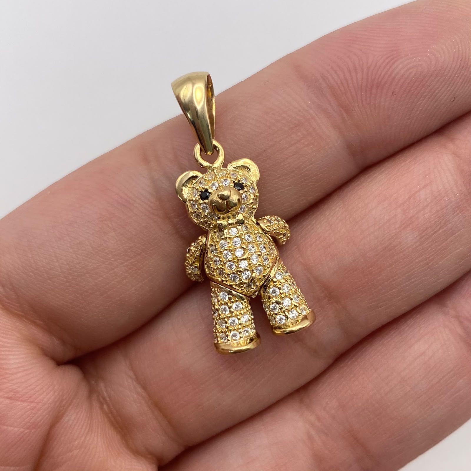 Dije oso articulado circones blancos y negro Oro amarillo 18k 4,89 Gr / 13,45 mm / 3 Cm