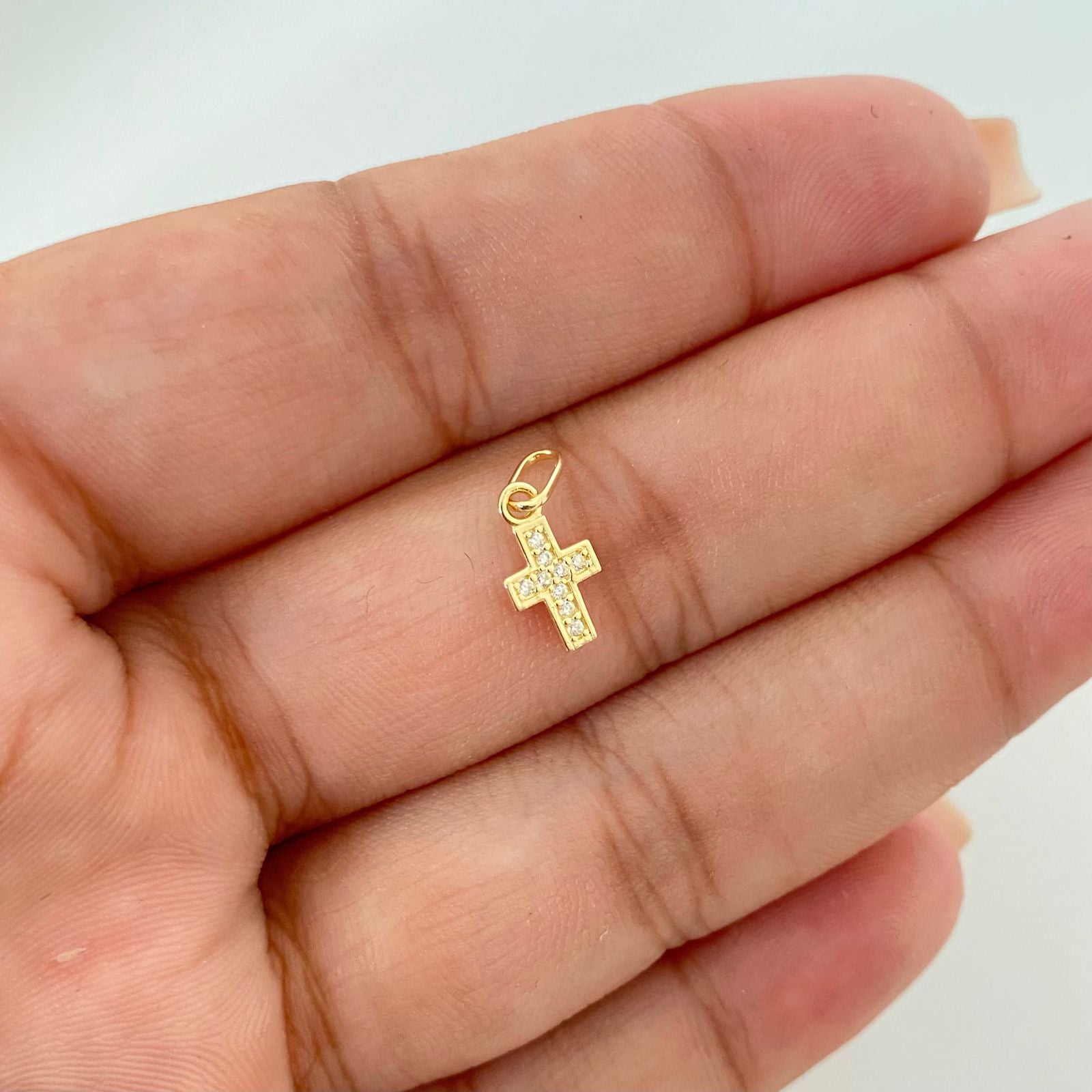 Dije mini cruz casting Oro amarillo 18k 0.40 Gr / 1,5 Cm