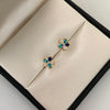 Topos flor circones azules Oro amarillo 18k 1 Gr / 8 mm