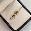 Herraje infinito con circones blancos  Oro amarillo 18k 1,2 Gr / 2 Cm