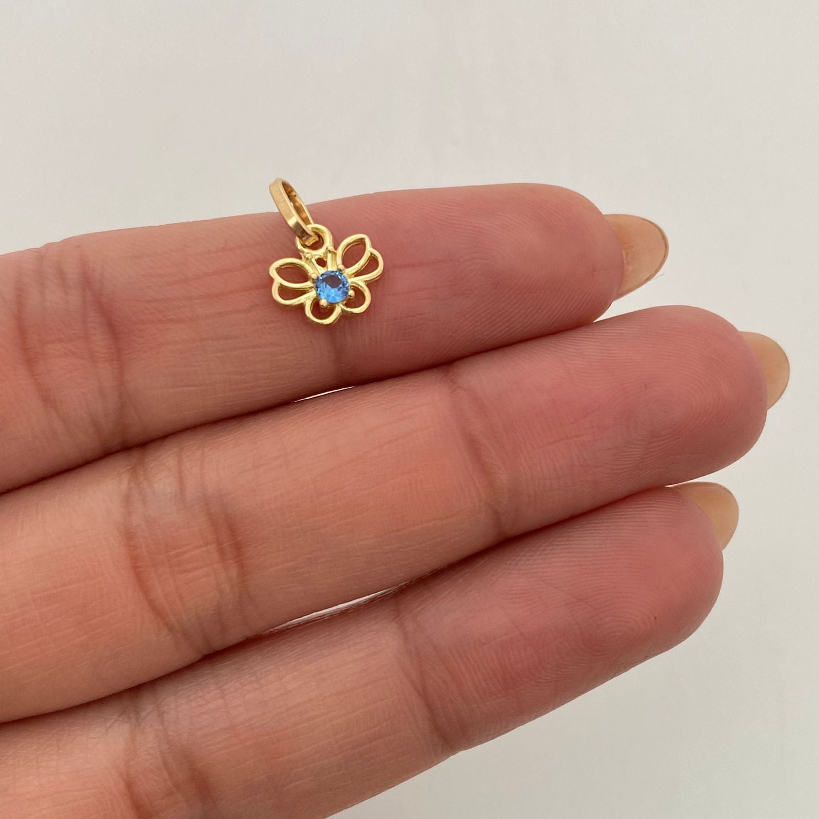 Dije Mariposa Circon Azul Oro amarillo 18k 0,65 Gr / 8,8 mm / 1,3 Cm