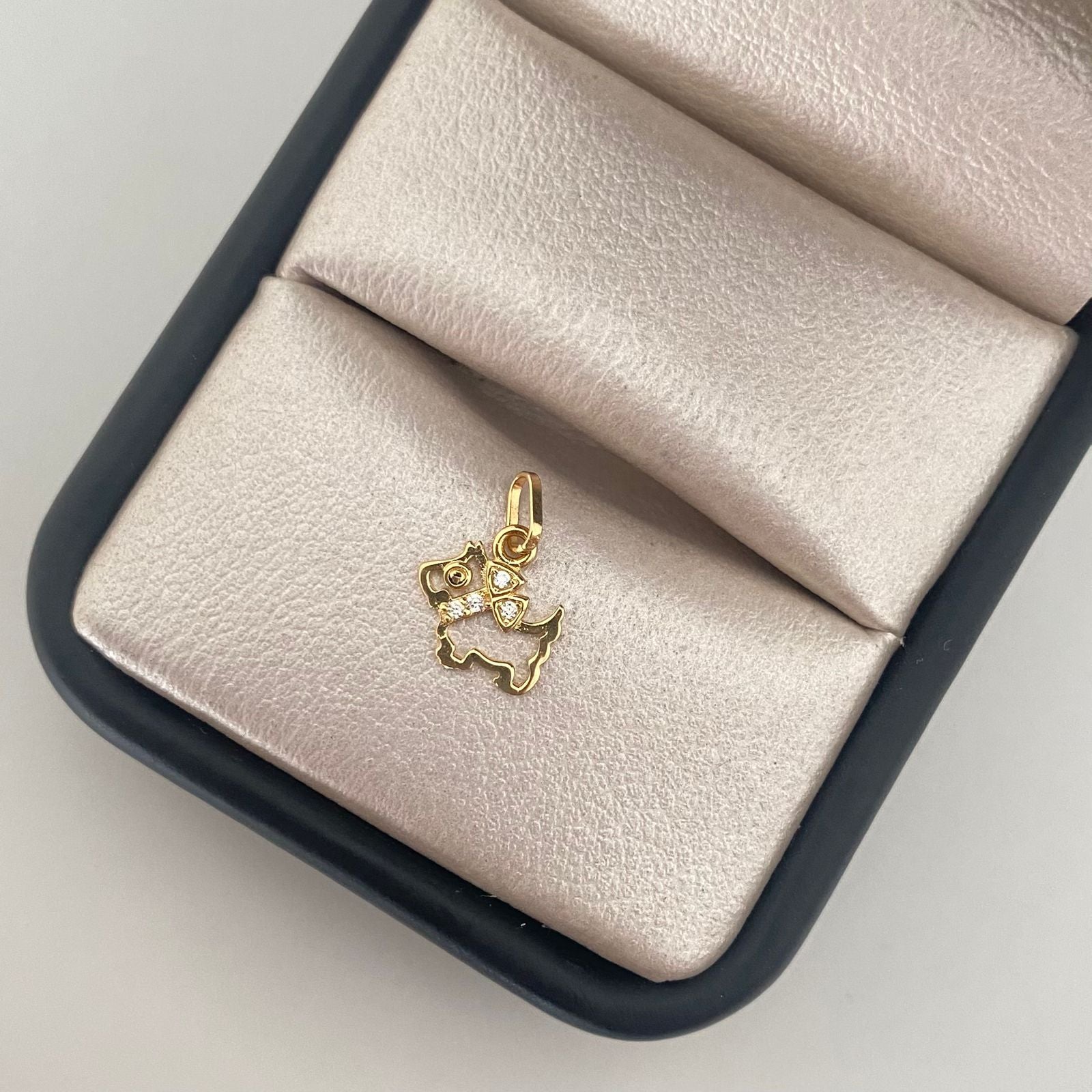 Dije silueta perrito moño casting Oro amarillo 18k 0,40 Gr / 1,0 Cm