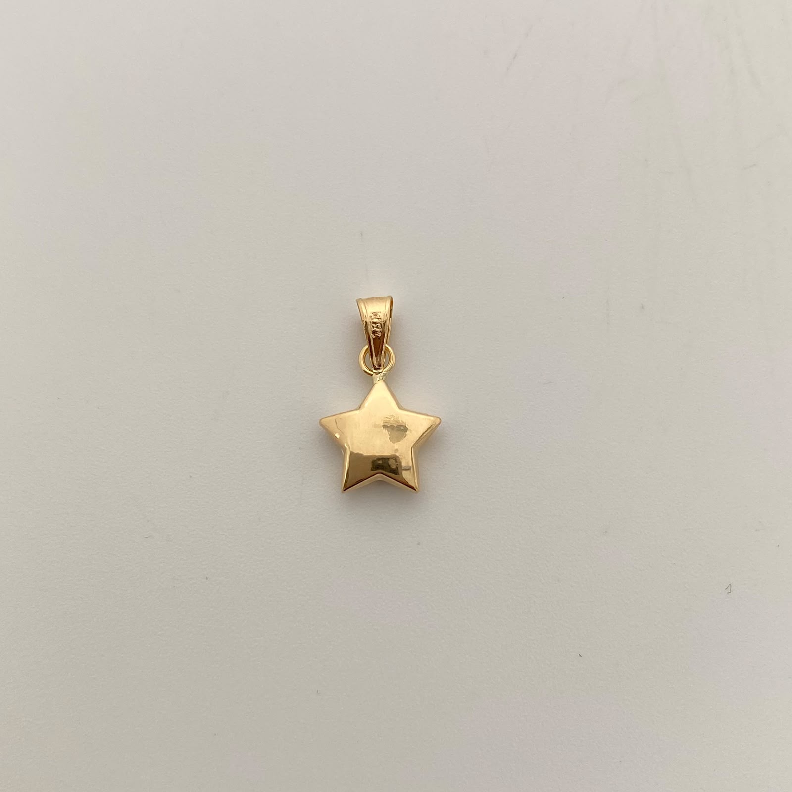 Dije Estrella Inflada Oro amarillo 18k 0,45 Gr / 9,9 mm / 1,7 Cm