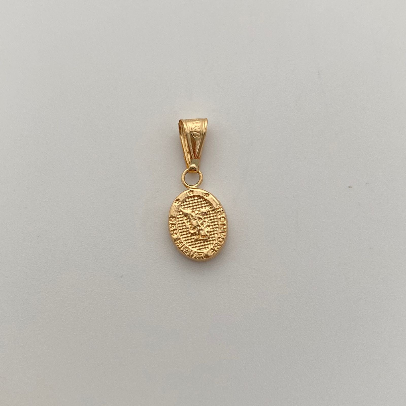 Dije San Miguel Oro amarillo 18k 0,8 Gr / 10,5 mm / 2 Cm