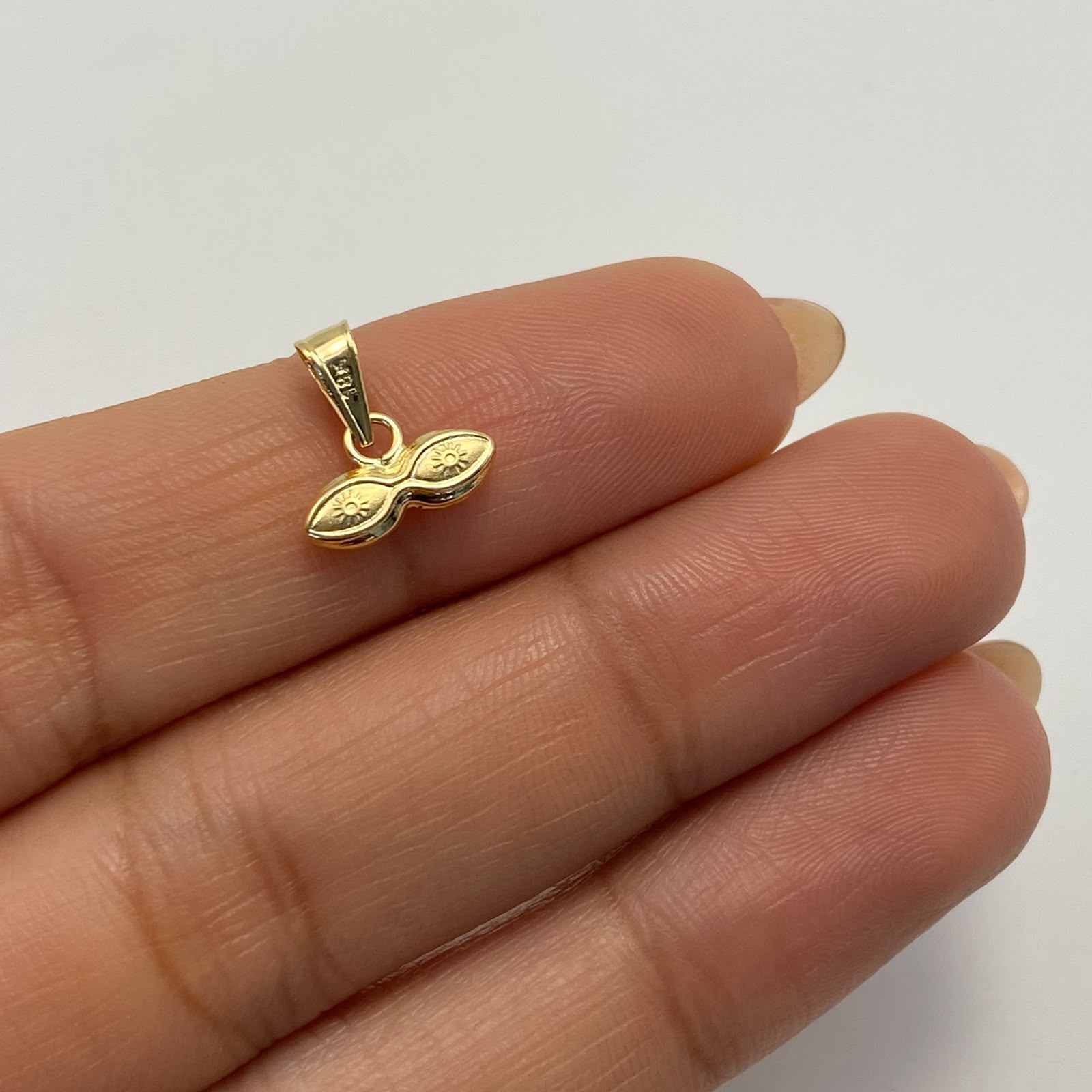 Dije Ojos de santa lucia Oro amarillo 18k 0,3 Gr / 10,8 mm / 1 Cm