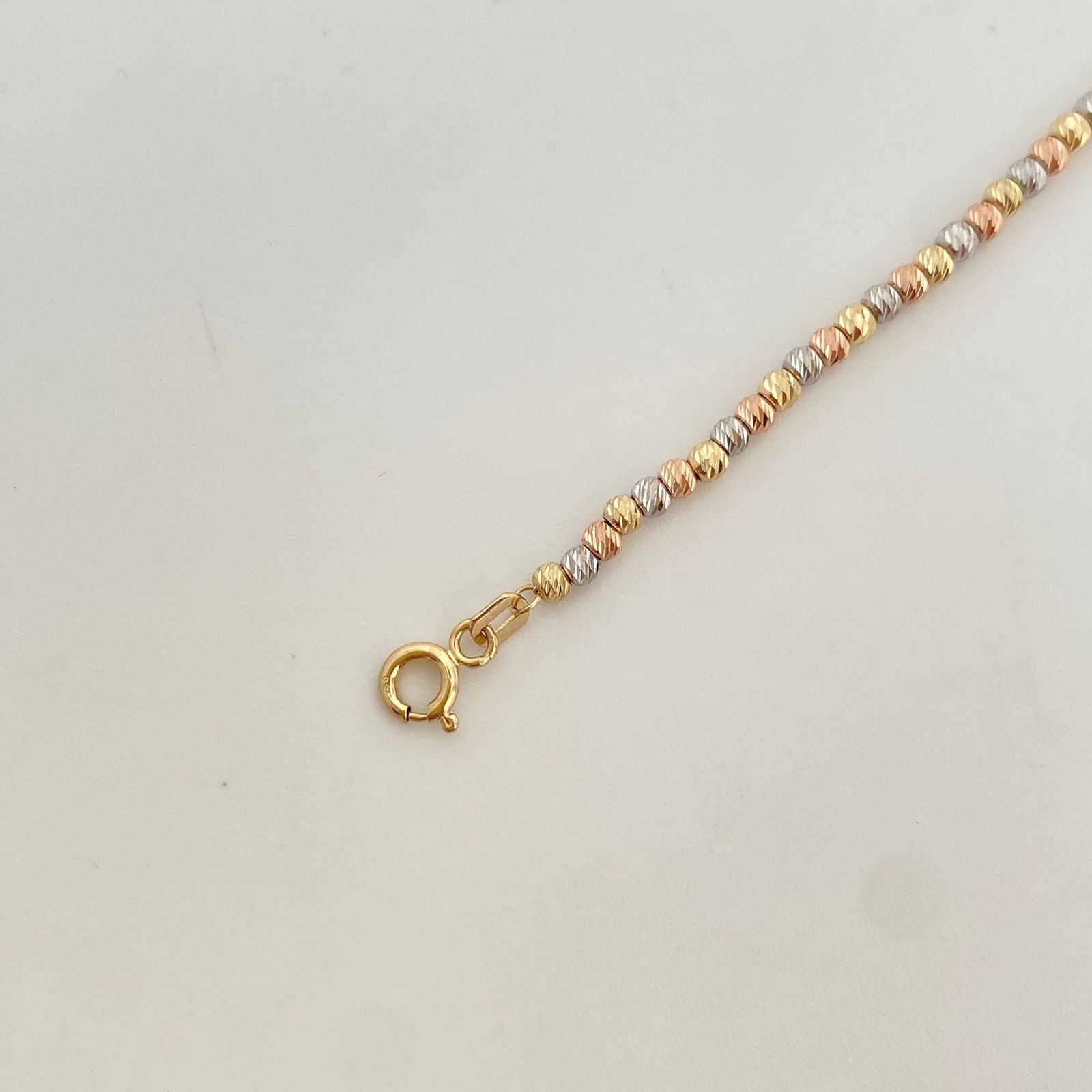 Pulso It centro cruz lisa balines diamantados Tres oros 18k +4 / 4,15 Gr / 2,55 mm / 18 Cm